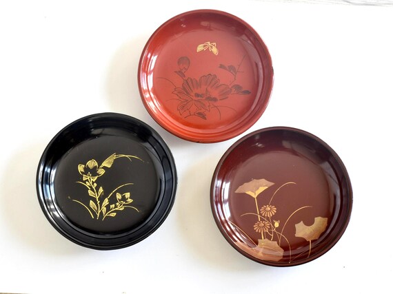 Japanese Urushi Lacquer Plates set of three vintage serving trays arranged together on a white surface