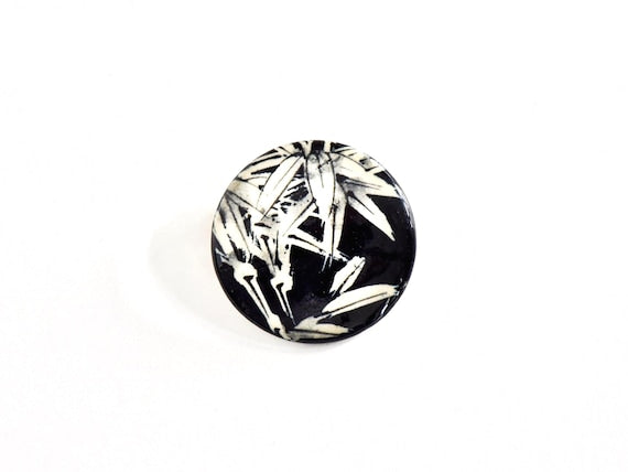 Kiyomizu Porcelain Bamboo Leaf Brooch featuring a round ceramic surface with a black and white bamboo design