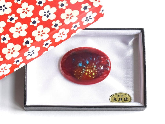 Kutani Dark Red Ceramic Brooch inside its original white satin lined box with a red and white floral patterned lid