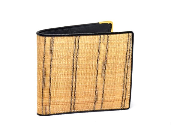 Bashofu banana fiber purse folded and standing upright on a white surface