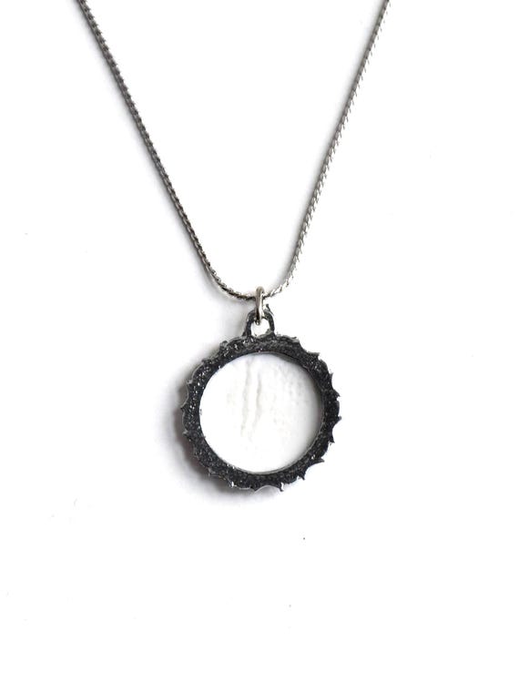 Kiyomizu-yaki Blue Floral Pendant Necklace showing the plain white back of the porcelain pendant