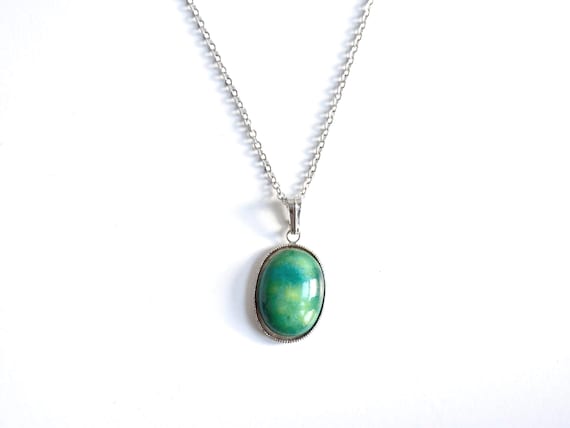 Green Oval Kutani pendant necklace displayed on a plain white background