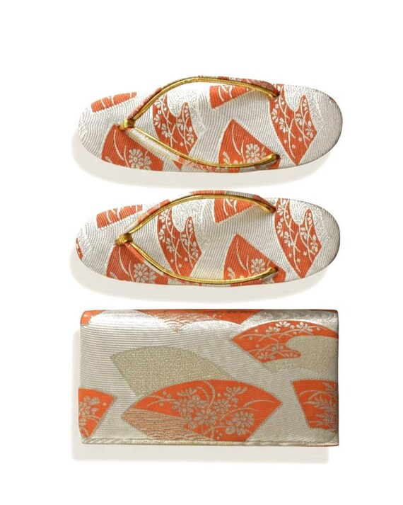 Gold Brocade Zori Sandals And Clutch Set laid flat to show the detailed Japanese brocade pattern and gold straps