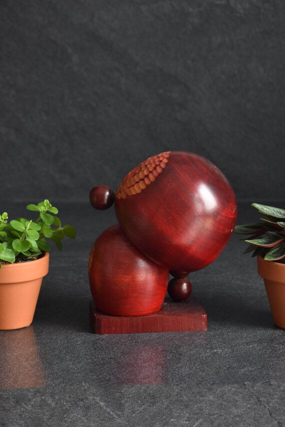 Chie Tamura Pigtail Kokeshi Doll back view displaying the smooth round head and wooden base