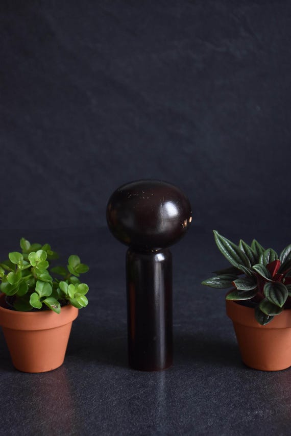 Japanese Kokeshi Doll vertical profile highlighting the slender cylindrical body and round head