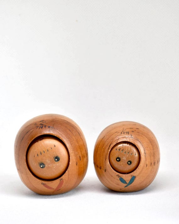 Creative Kokeshi Pair handmade wooden Japanese dolls shown from the front with painted facial features