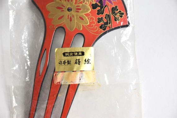 Japanese Red Lacquer Fork hair comb close up of packaging label with Japanese text