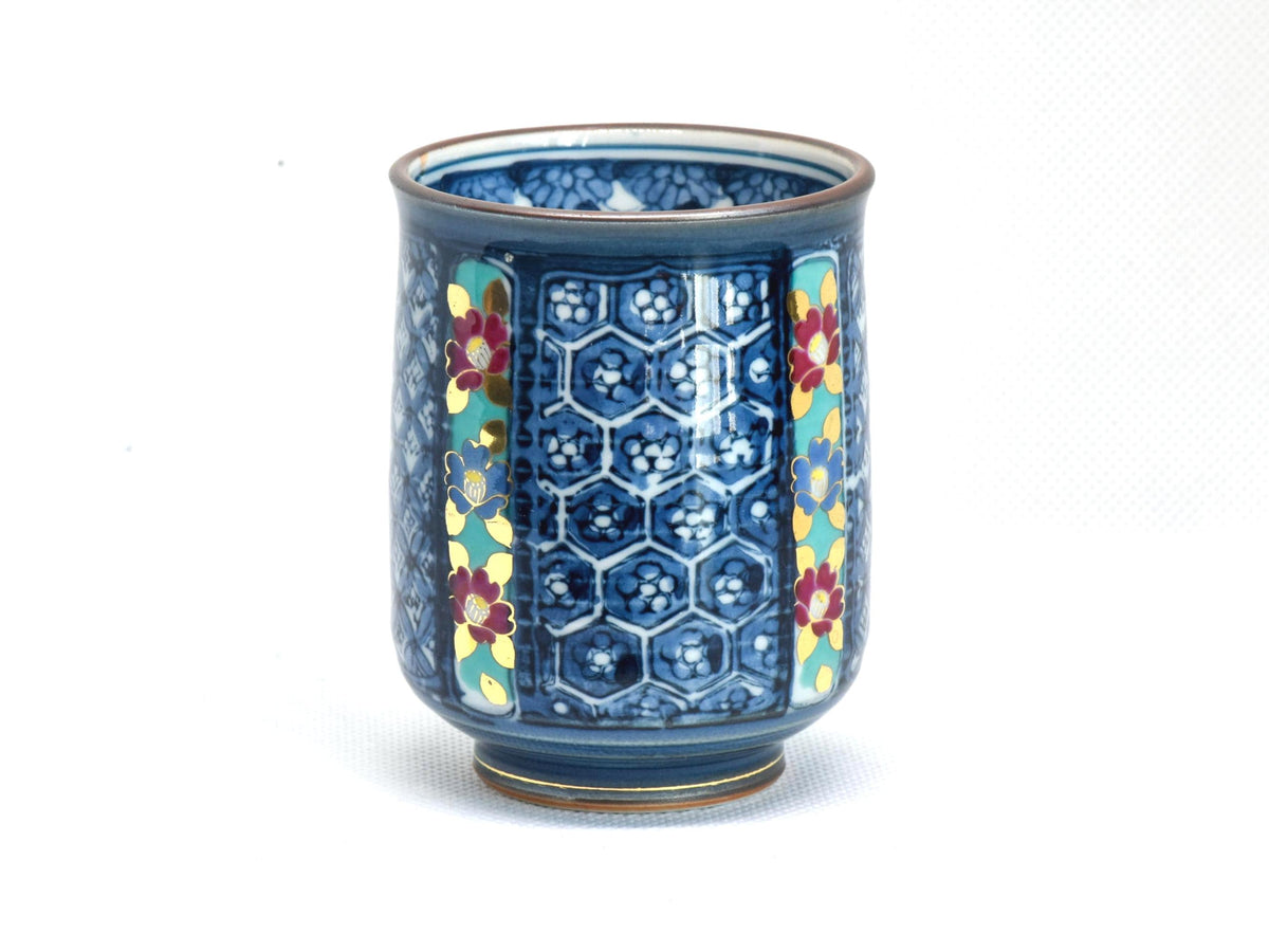 Kiyomizu-Yaki Yunomi cup showing a panel with blue and white geometric patterns