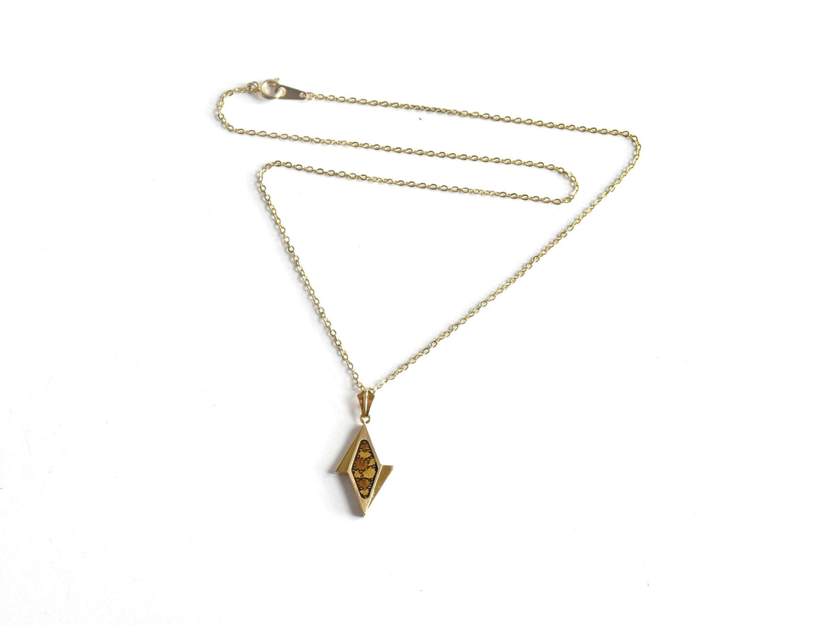 Japanese Damascene diamond pendant necklace laid out displaying the clasp