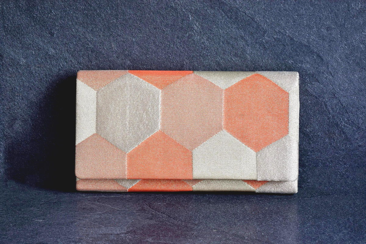 Nishiki Weave Geometric Obi Clutch Bag showing the front flap and hexagonal textile pattern