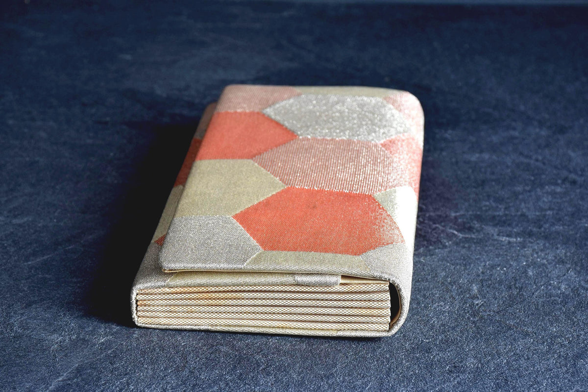 Nishiki Weave Geometric Obi Clutch Bag side view showing the pleated accordion gusset
