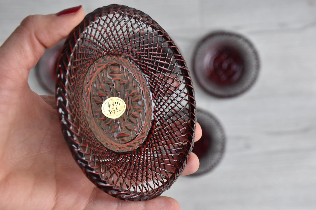 Floral Etched Glass And Rantai Shikki Bamboo Tea Set single woven bamboo coaster held in a hand showing texture