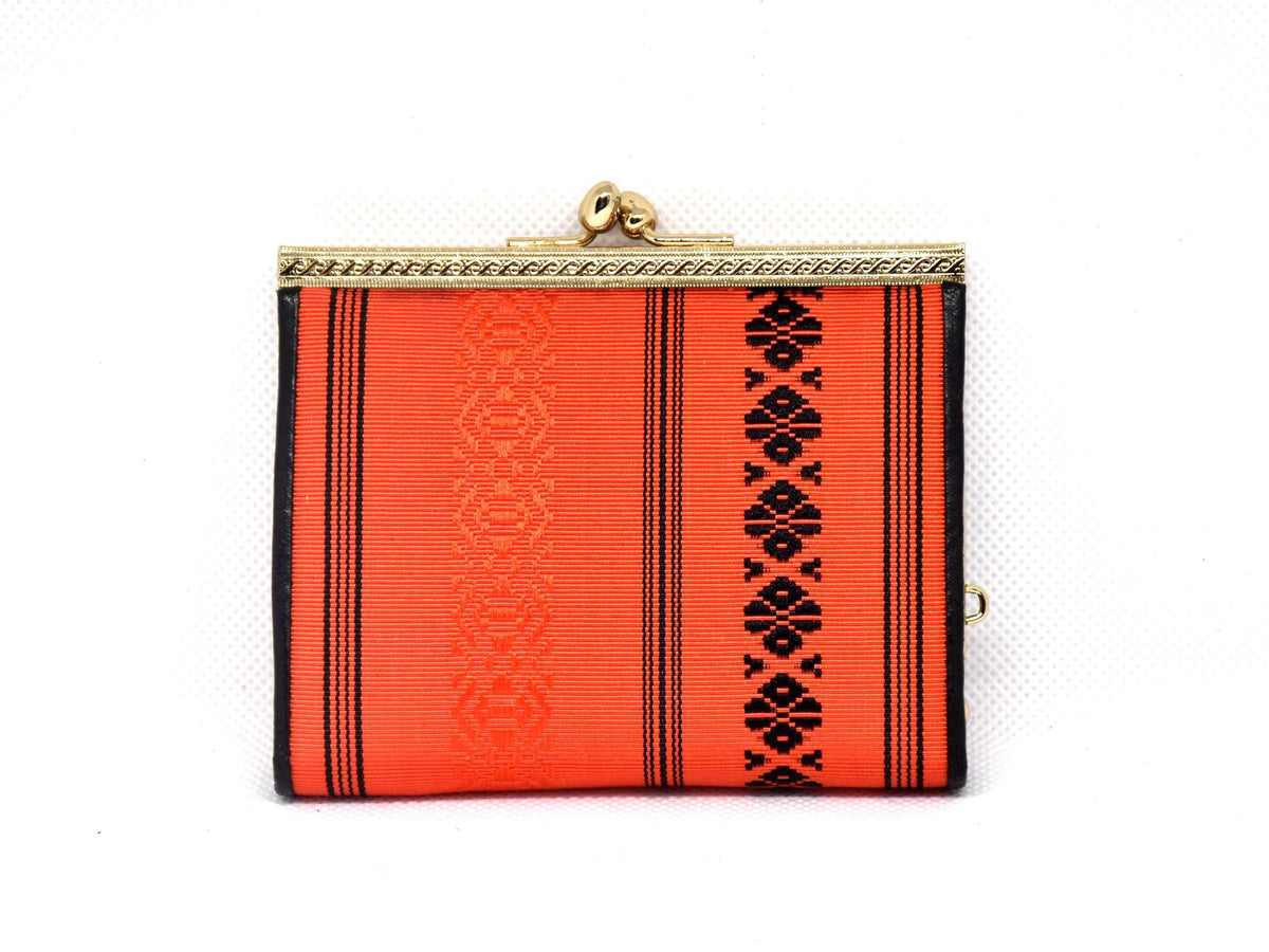 Vermilion Hakata-Ori Silk Clasp Coin Purse photographed from the front showing the striped textile