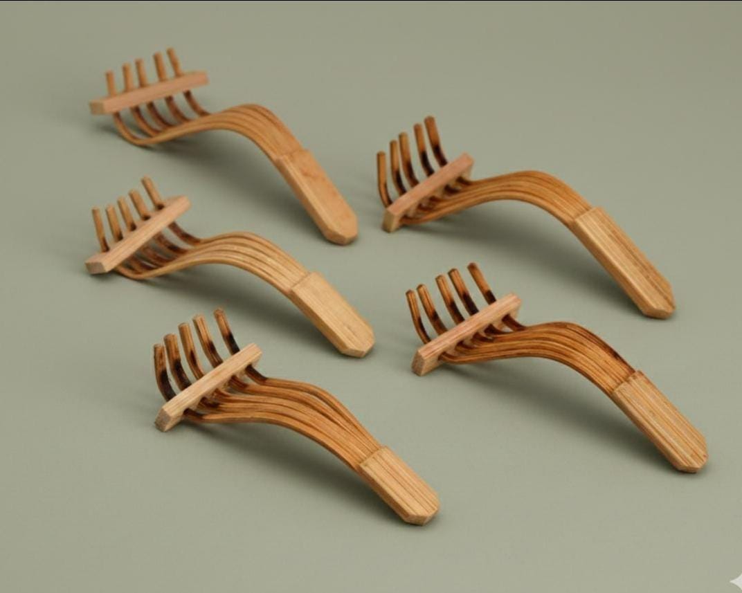 Bamboo Rake Chopstick Rests Set Of 5 arranged on a green surface