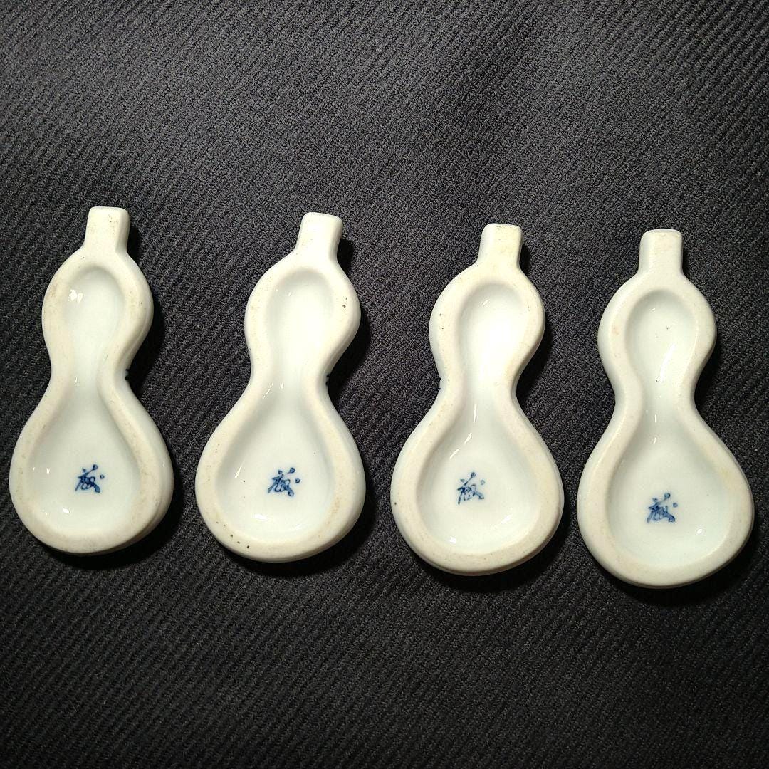 Porcelain gourd chopstick rests bottom bases showing the hollow shape and blue mark