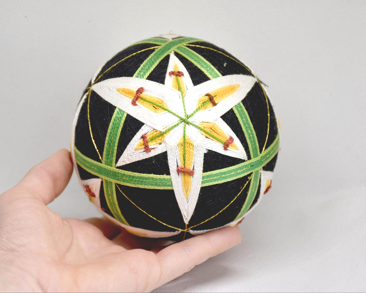Hand-Embroidered Japanese Temari Ball Folk Art held in a hand to show size