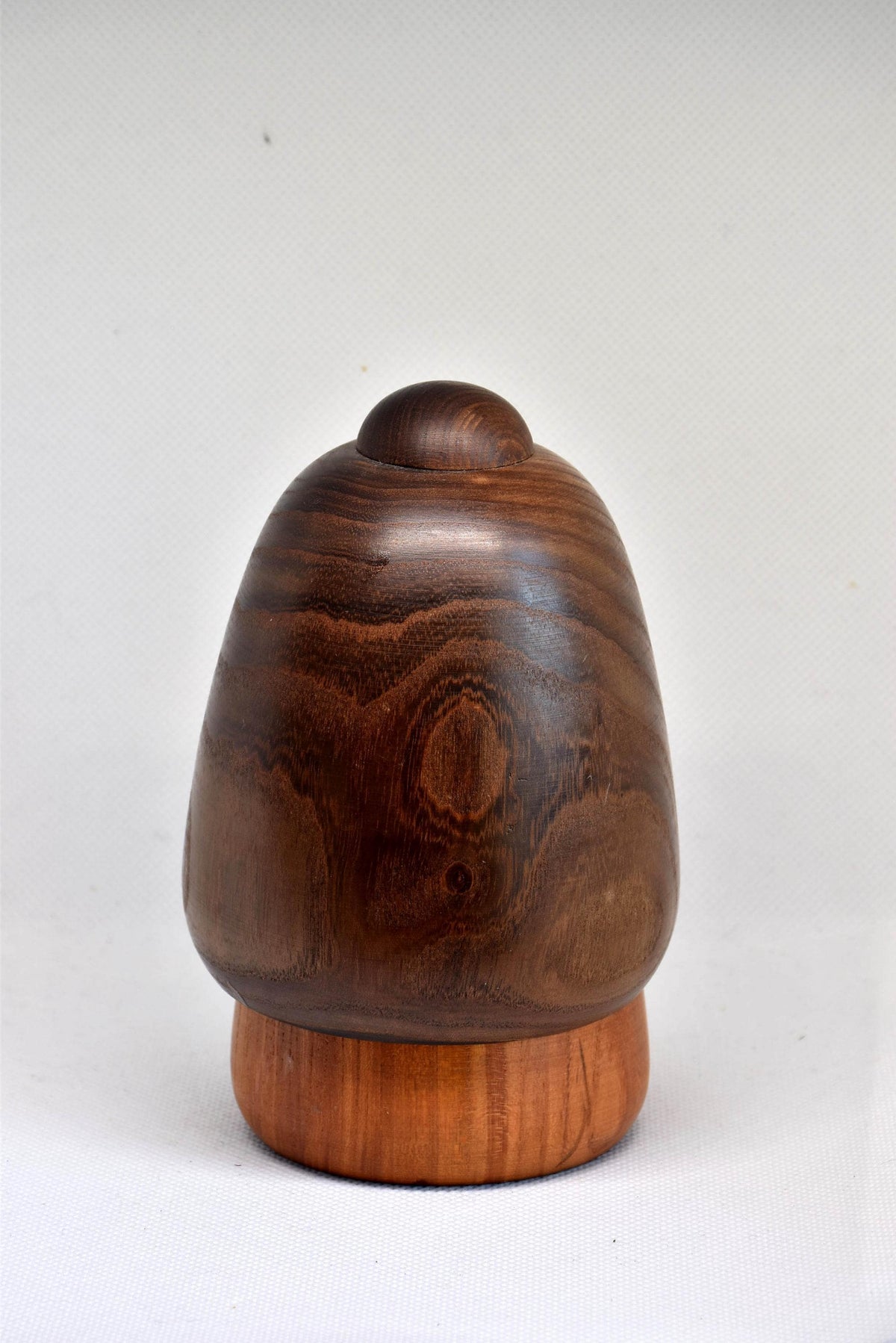 Daisuke Takeda Sosaku Kokeshi showing the rounded back view of the doll with the pine motif