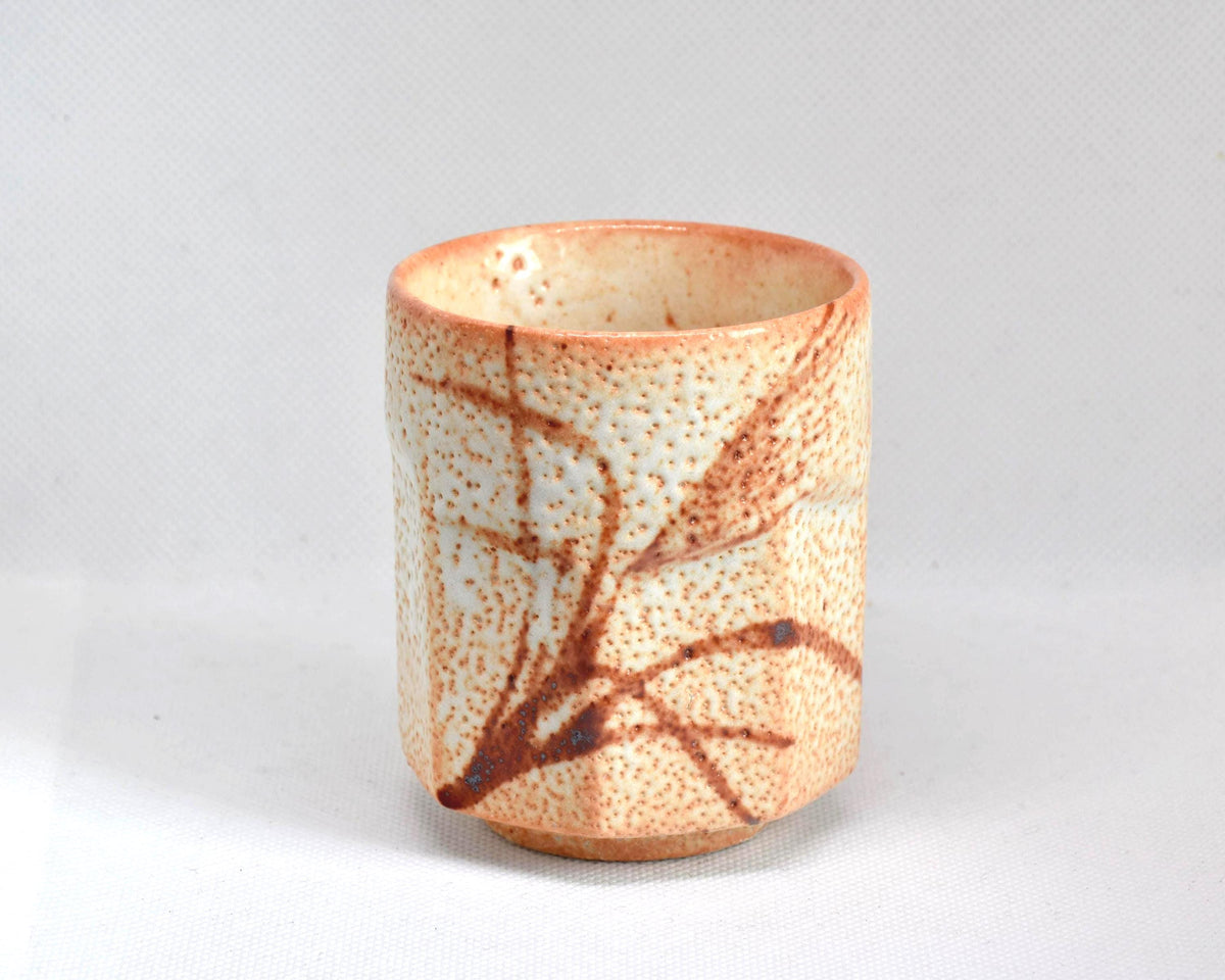 Shino-Yaki Yunomi tea cup featuring pattern detail and thick glaze
