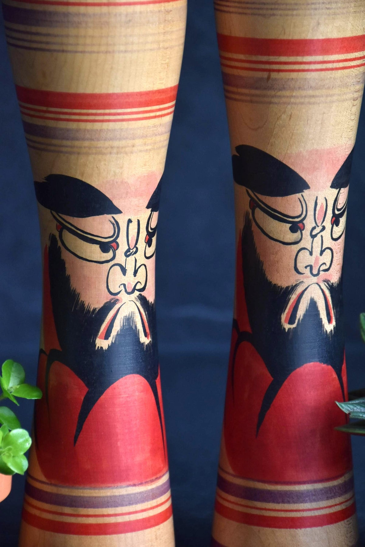 Zenji Sato kokeshi dolls detail view of the hand-painted Daruma motif