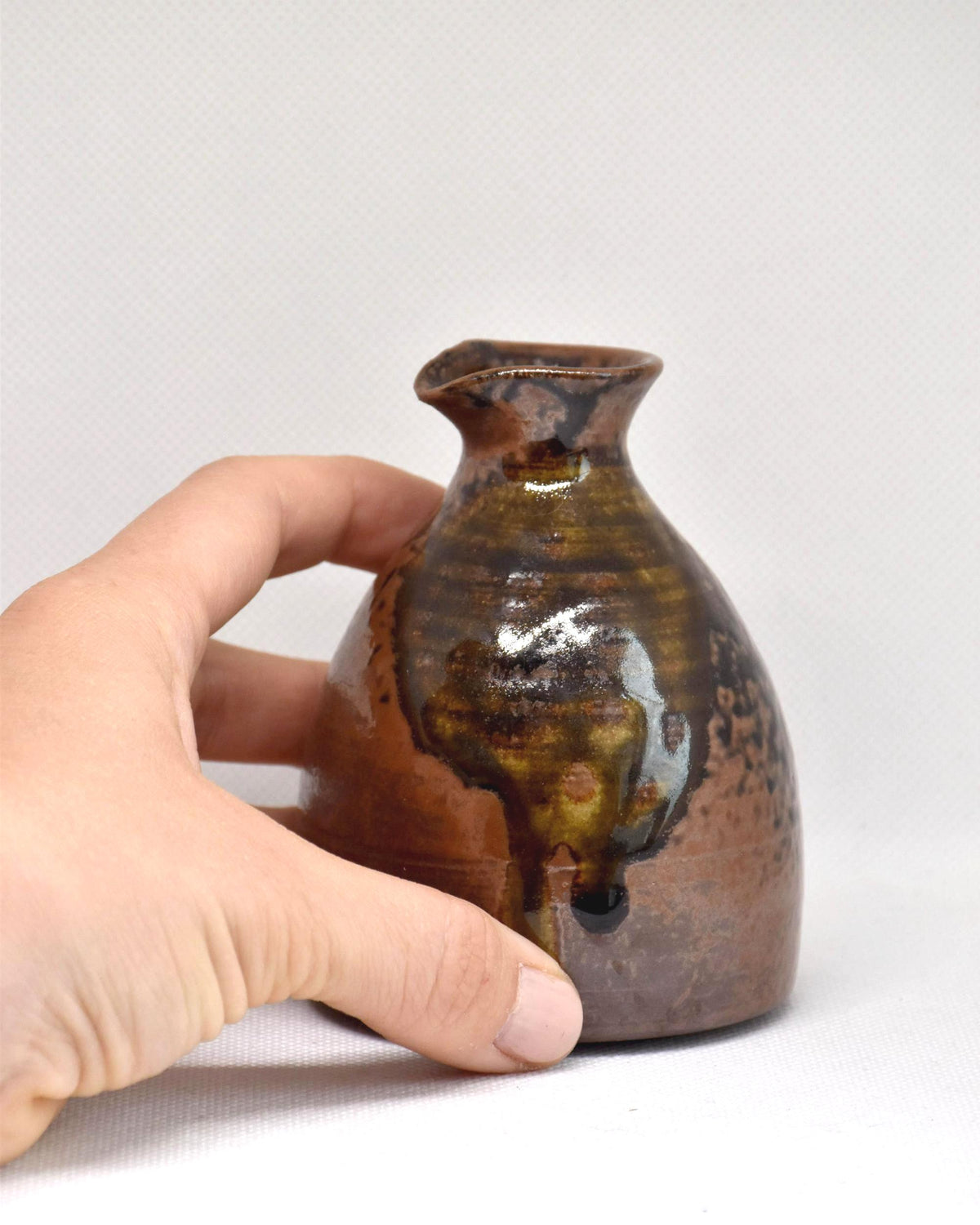 Bizen Style Stoneware Tokkuri shown next to a hand for size