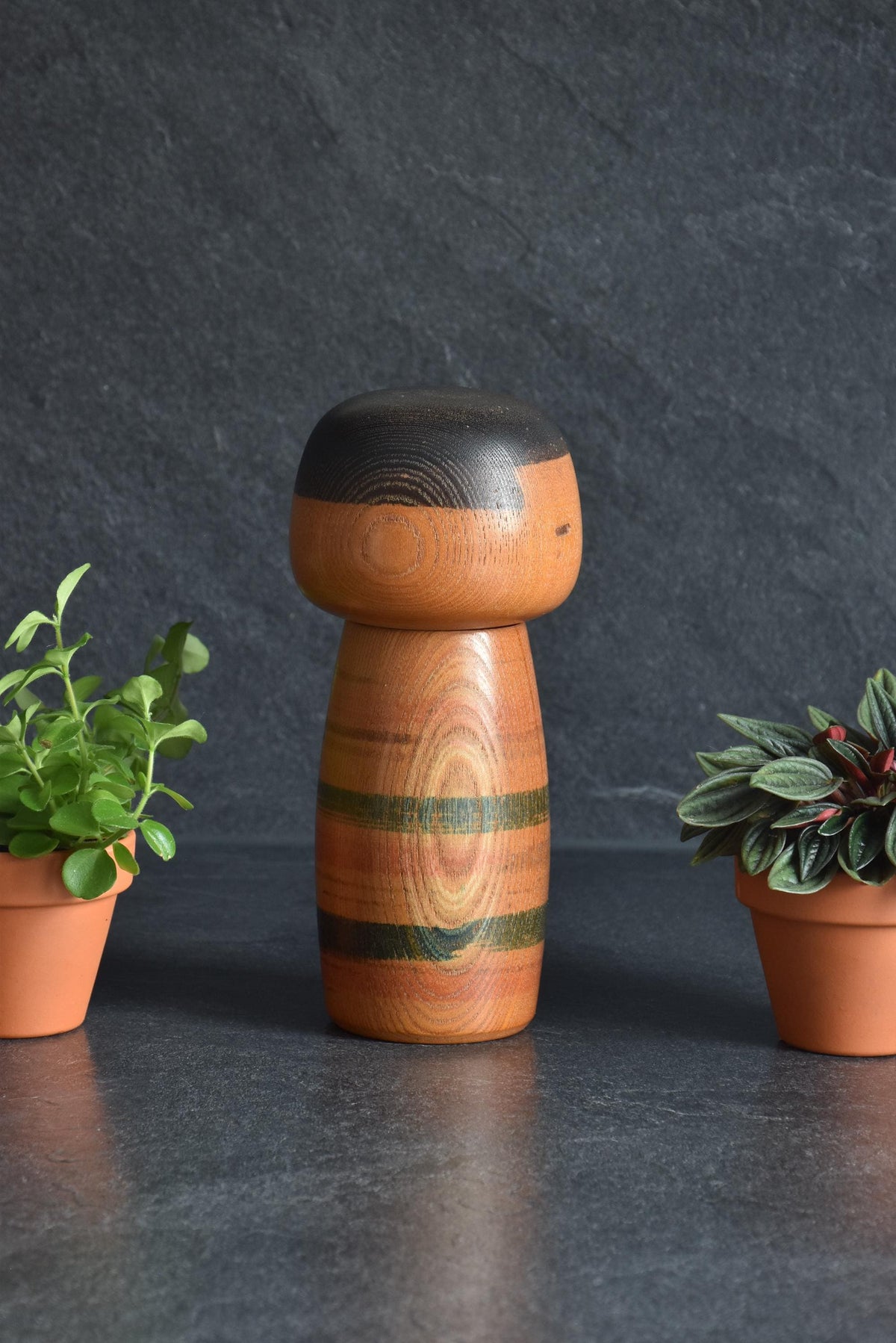 Sanpei Yamanaka Sosaku Kokeshi doll side profile showing wooden texture and form