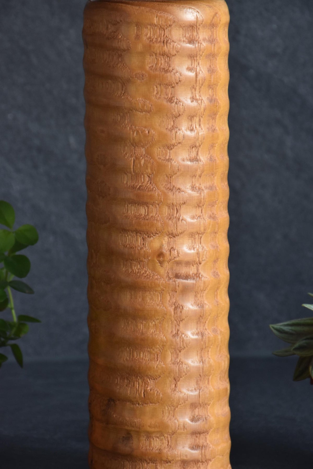 Usaburo Sosaku Kokeshi doll close-up of the scalloped textured carving on the wooden body