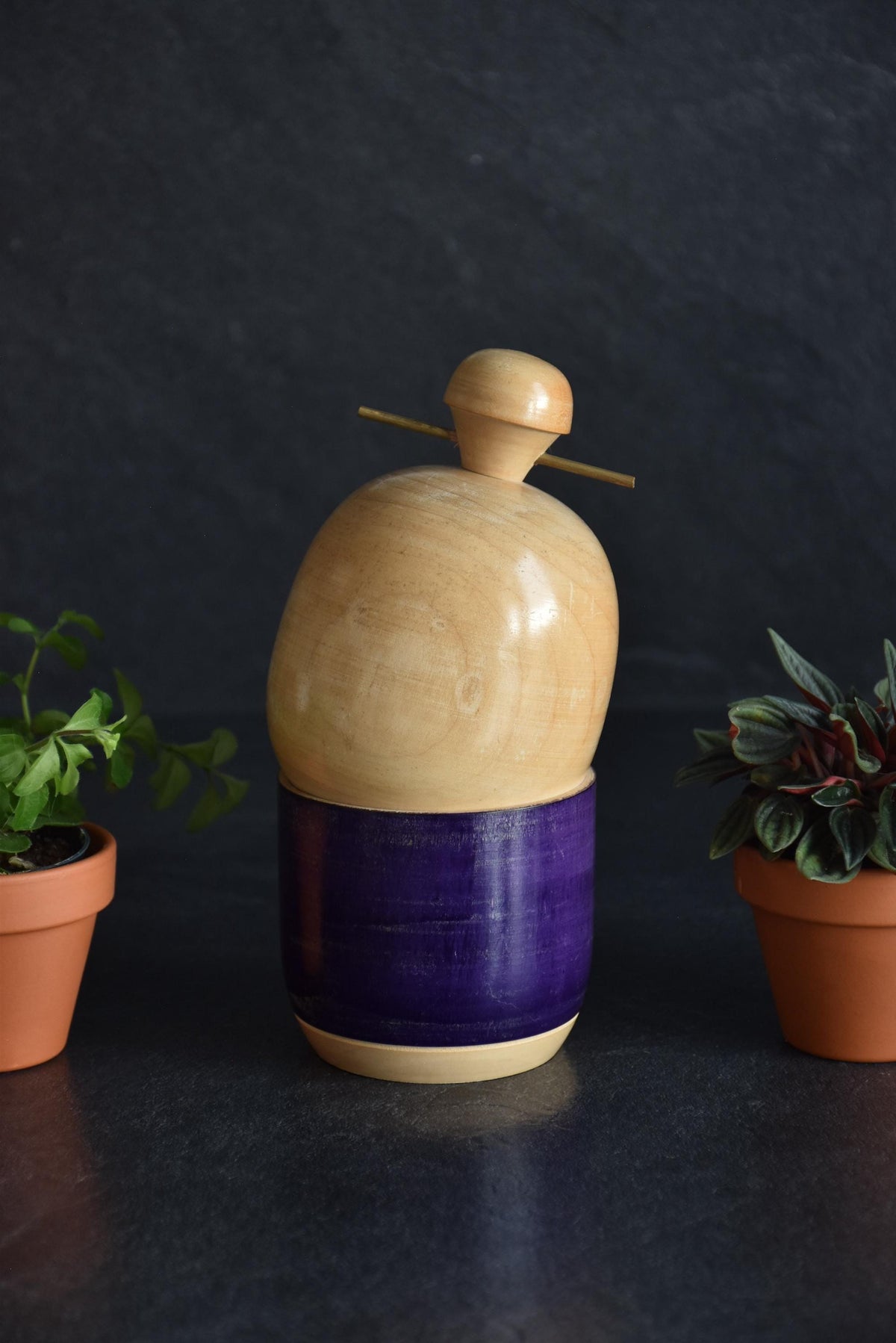 Sato Suigai kokeshi showing the plain back of the natural wood head