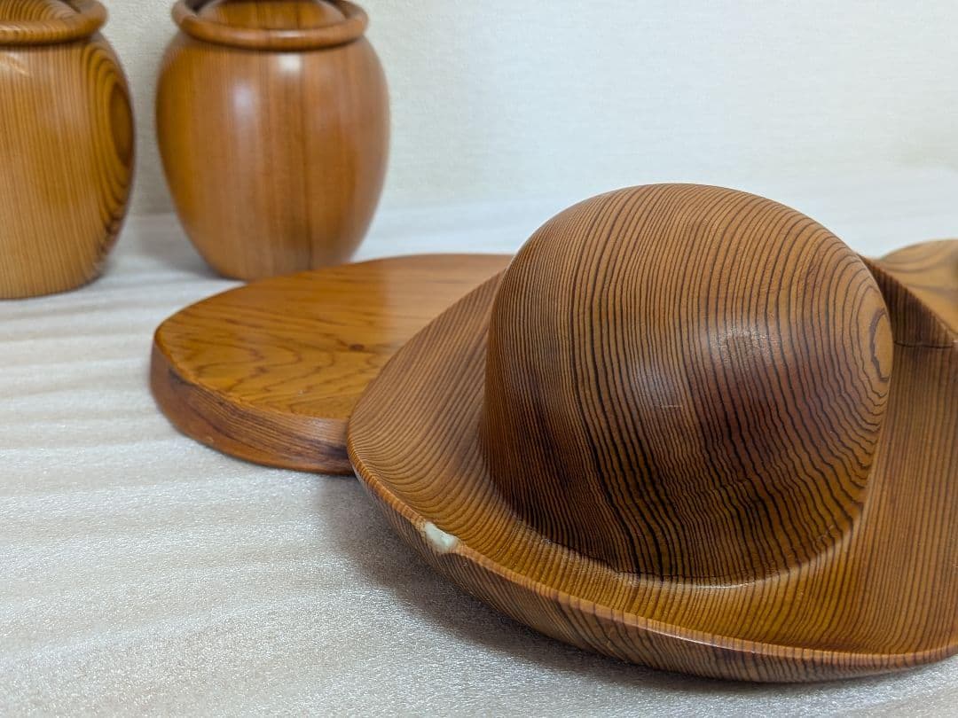 Yakusugi Cedar Sosaku Kokeshi Hat detail showing a chipped rim and glue residue near the edge