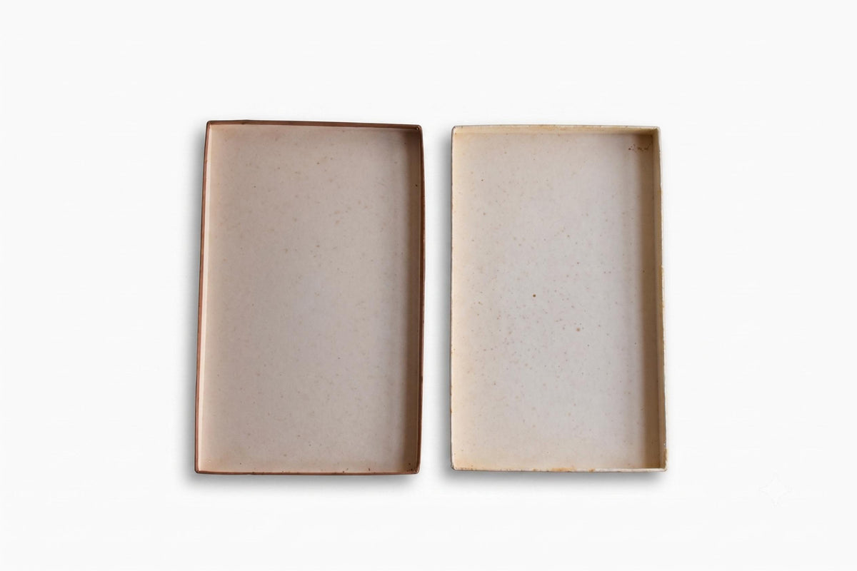 Interior view of the open original paperboard storage box showing its speckled light lining