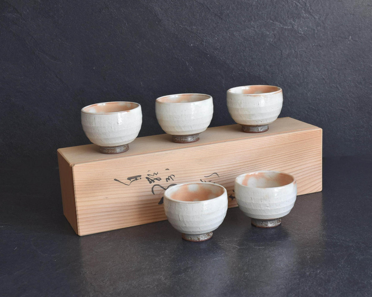 Set Of 5 White Kumidashi Teacups In Paulownia Box arranged with their original wooden tomobako storage container
