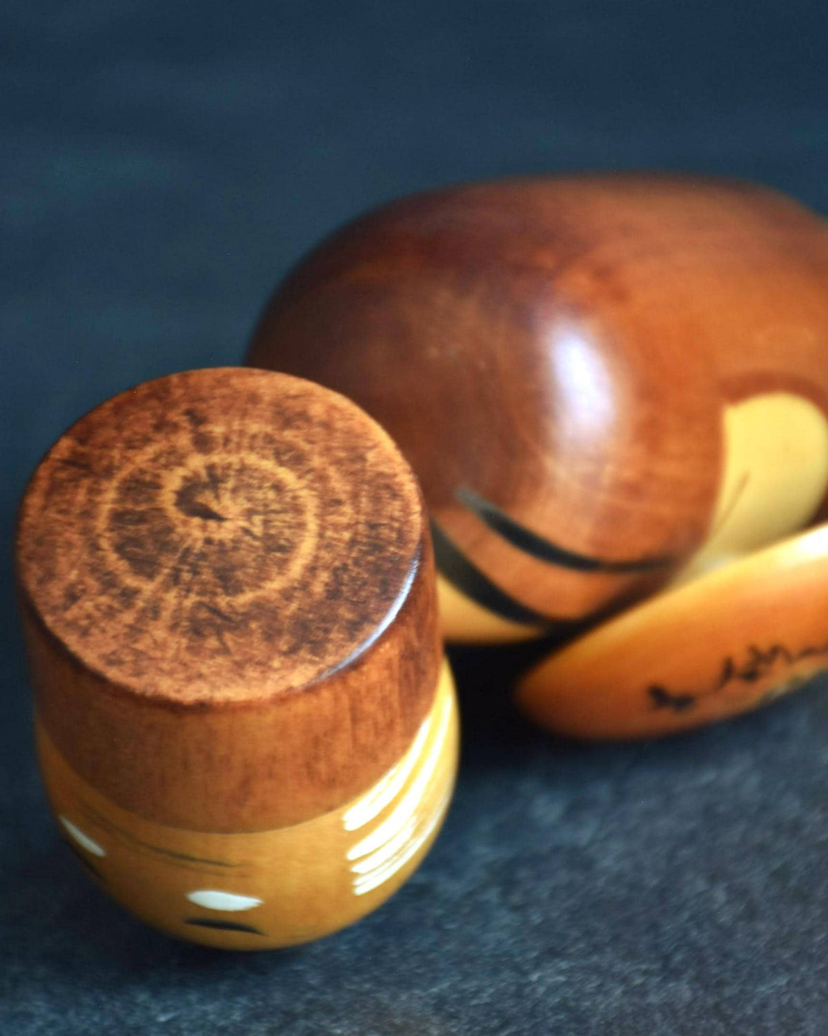 Hajime Miyashita Creative Kokeshi Matsuo Basho with head detached, displaying the top wood grain pattern