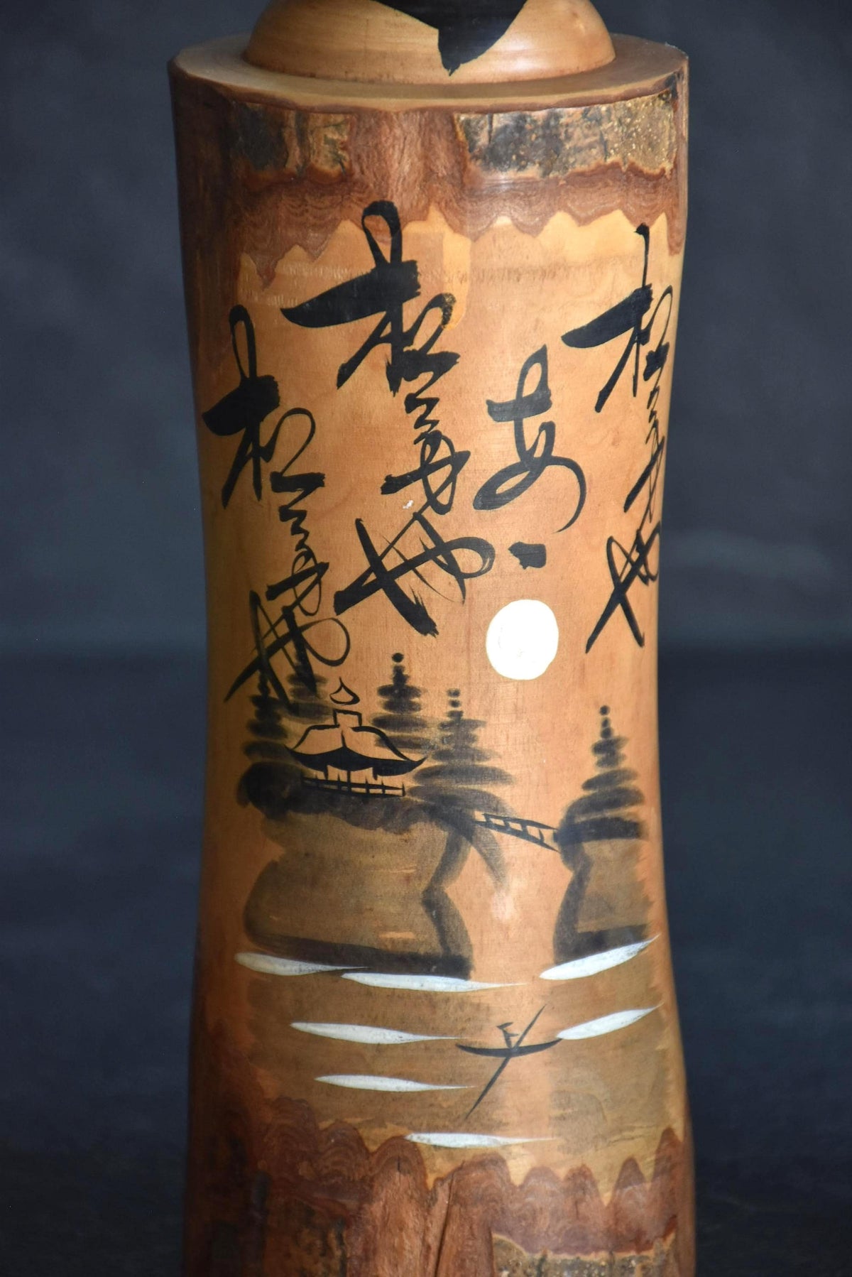 Large Wooden Kokeshi Doll Landscape Calligraphy close-up of the painted landscape scene and calligraphy