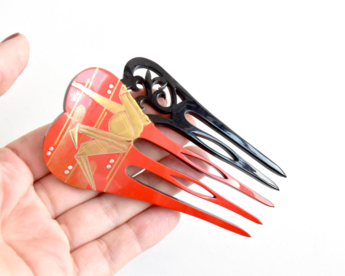 Kanzashi Hair Comb Origami Crane Red And Black Lacquer shown next to a hand for scale