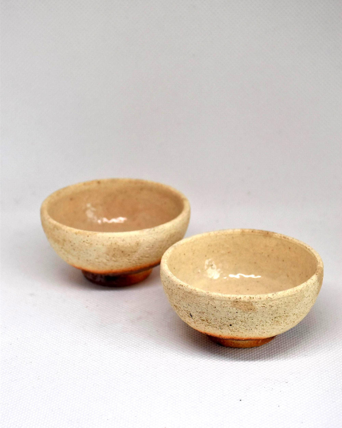 Ochre And Reddish-Brown Ceramic Sake Cup Pair front view angle