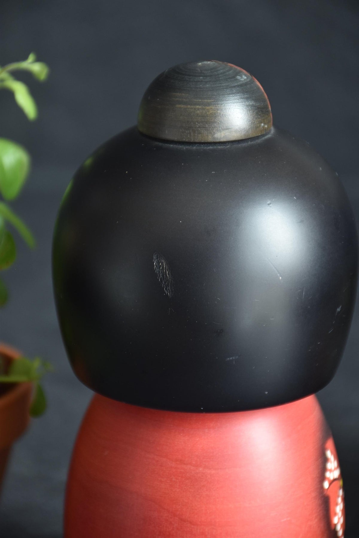 Masae Fujikawa kokeshi doll back of head showing texture and minor scratch detail