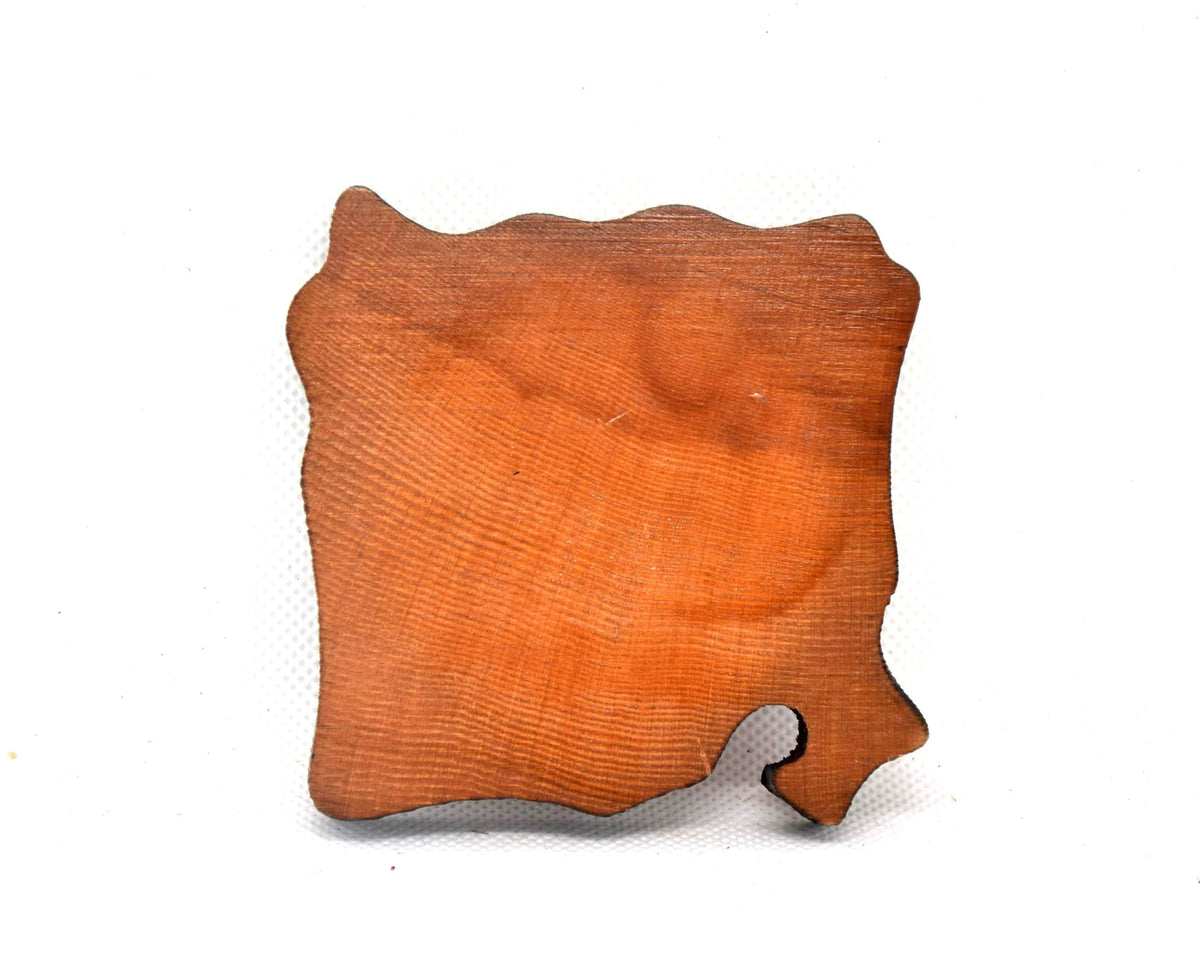Ainu wooden coaster showing the plain uncarved natural wood back of the man design
