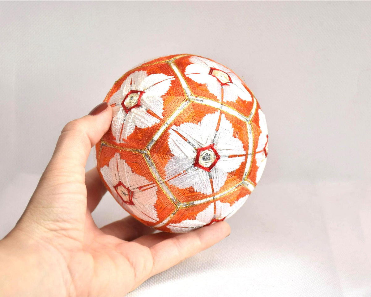 Hand-Embroidered Japanese Temari Ball Folk Art shown held next to a hand for scale