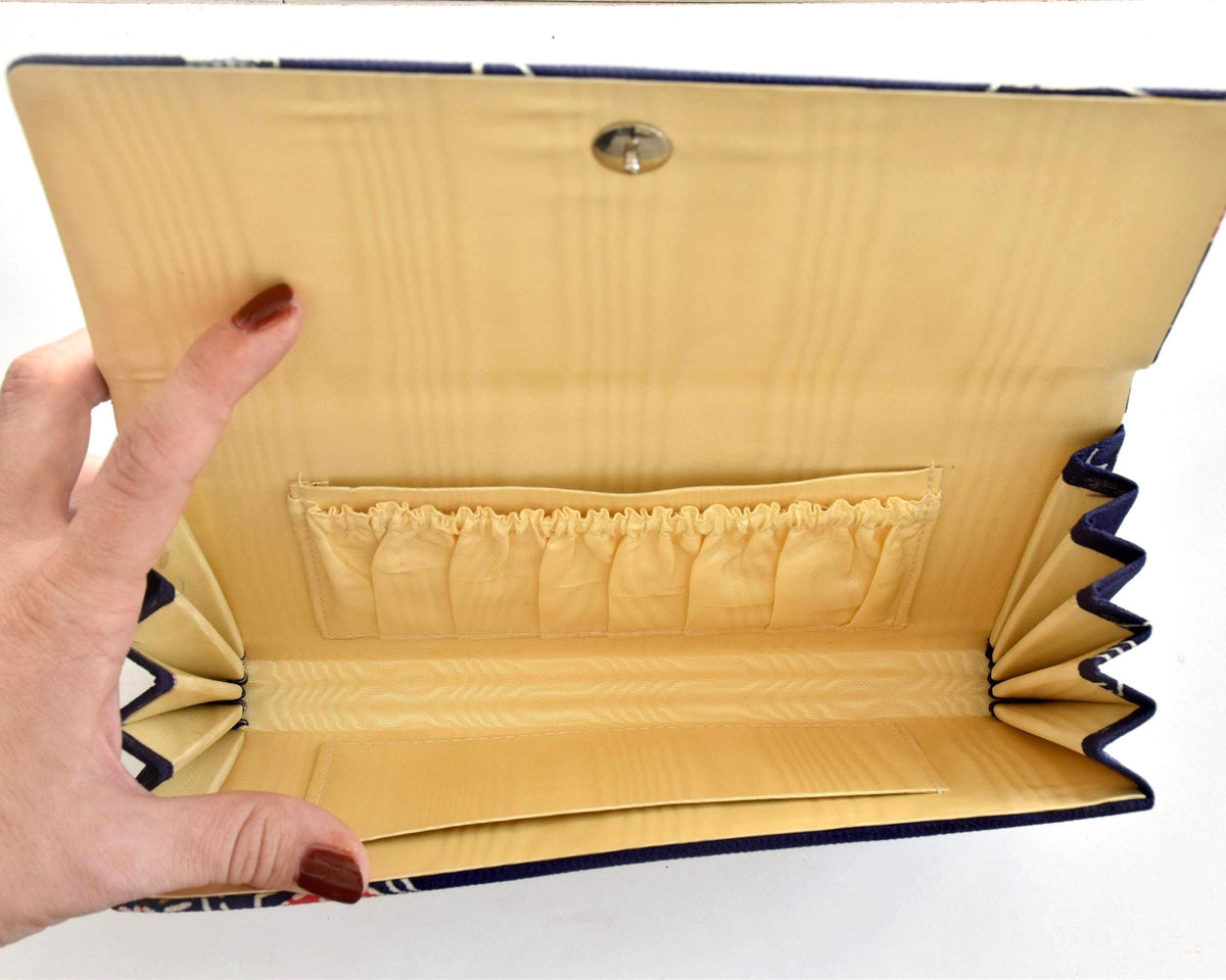 Navy Chirimen Kimono Clutch With Tsuru Crane Motif fully open showing satin interior and pockets