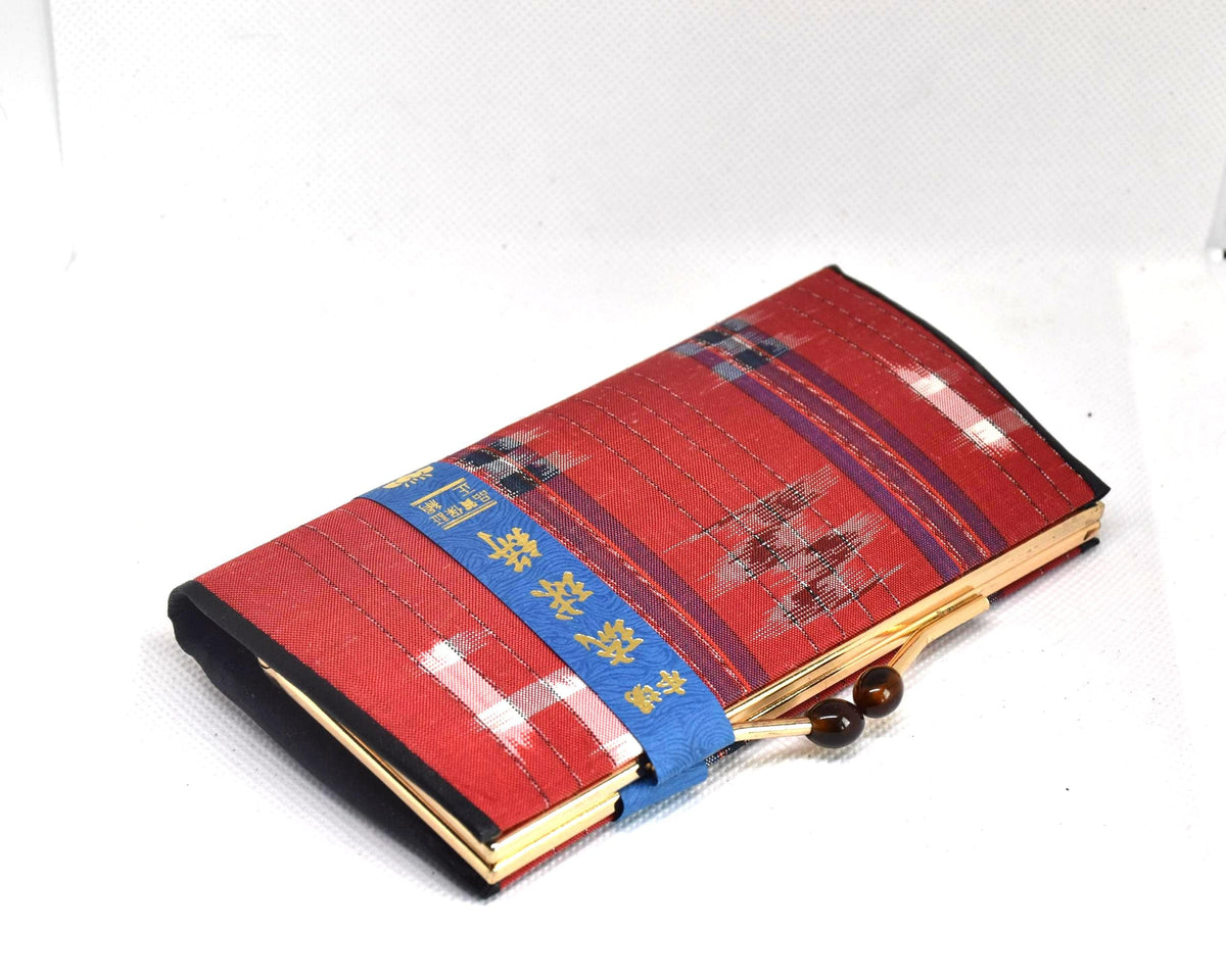Ryukyu Kasuri Geometric Ikat Silk Wallet Red angled view showing clasp and fabric label