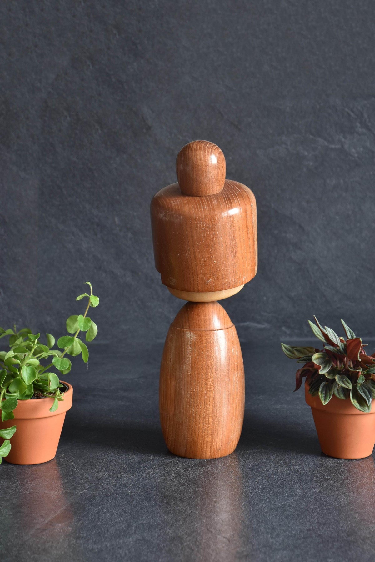 Masuo Sato kokeshi doll showing the back view of the wooden head and body