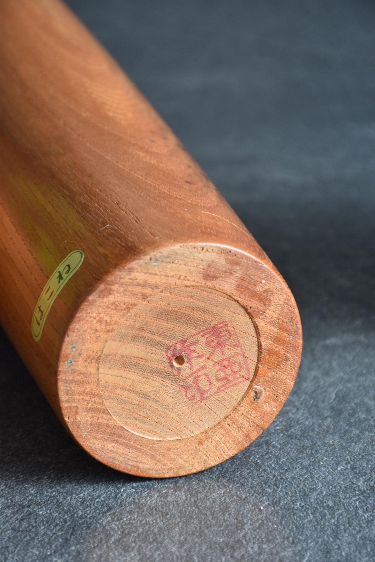 Toa Sekiguchi kokeshi doll base showing artisan signature stamp