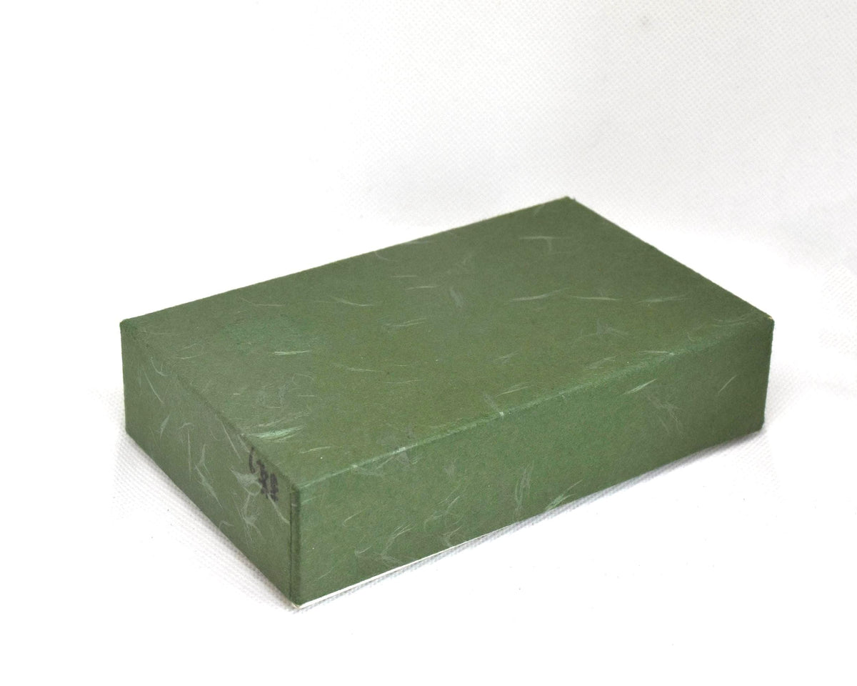 Yaeyama Minsa-Ori coin purse original green textured storage box seen from above