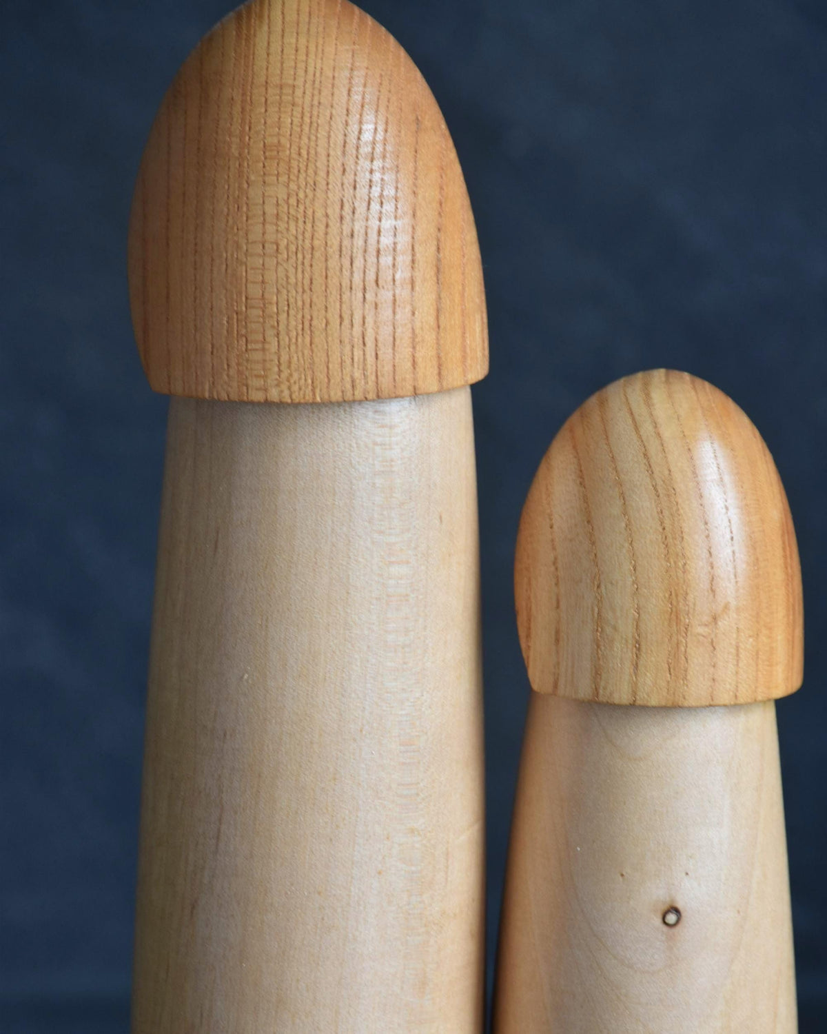 Shido Shozan kokeshi pair close-up of the snow cape hoods