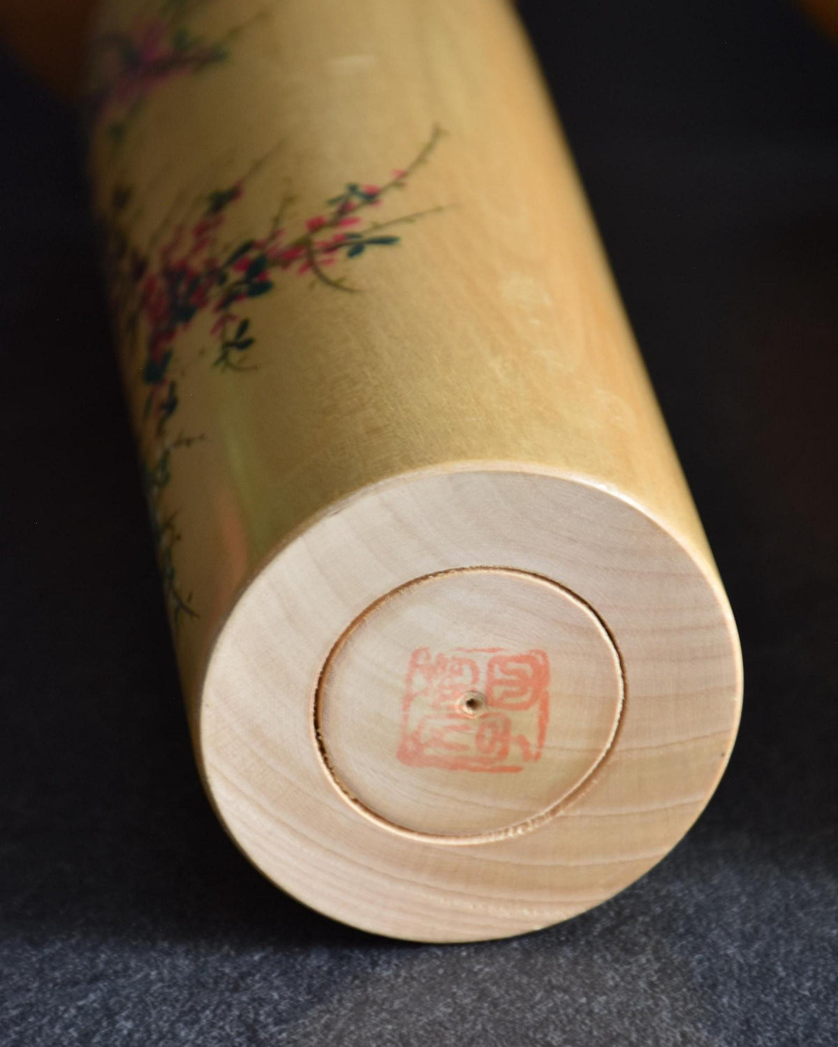 Pair of Japanese kokeshi dolls bamboo and floral motif bottom base with stamp