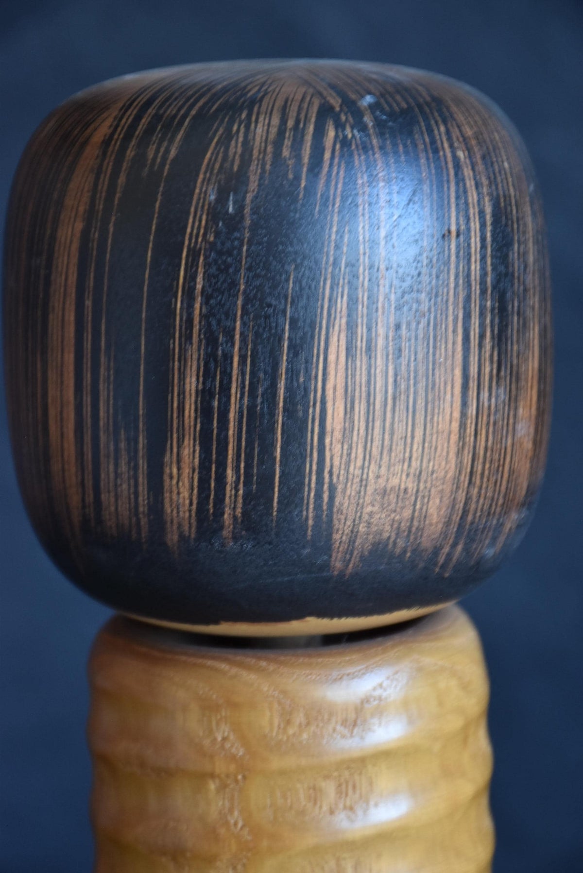 Usaburo sosaku kokeshi head detail showing top of the painted bob haircut