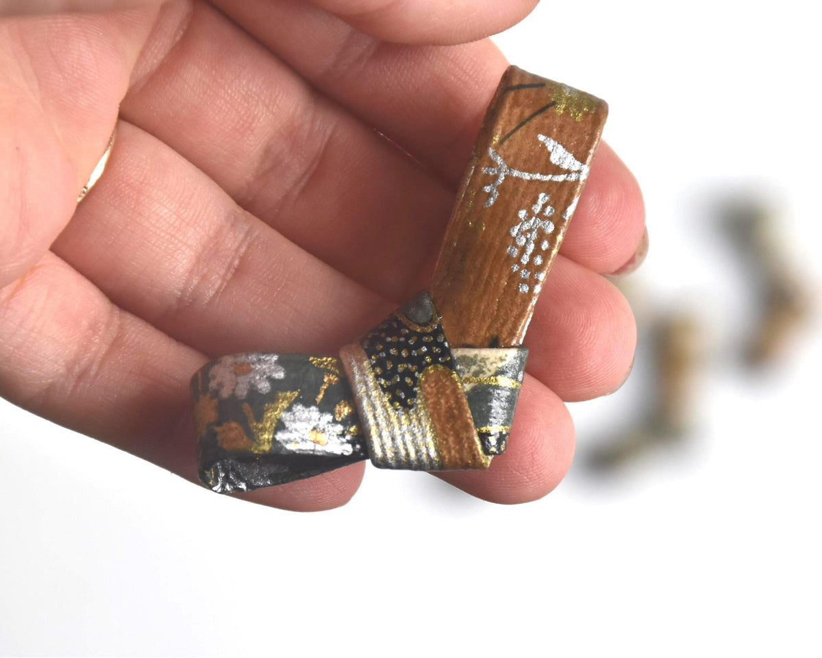 Japanese Washi Paper Chopstick Rests Red Kimono single hashioki shown closely in hand for scale