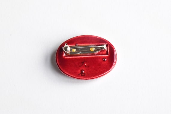 Kutani Dark Red Ceramic Brooch back view showing the secure metal pin and glossy glazed ceramic reverse side