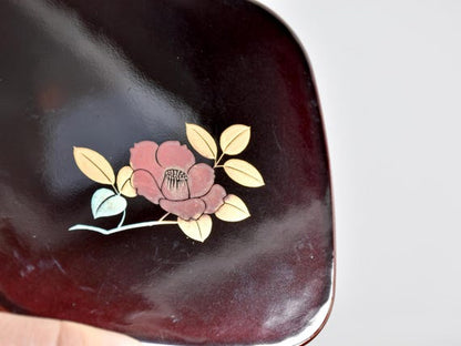 Japanese Urushi Lacquer Coaster Tsubaki Camellia serving tray showing a close-up pattern detail of the camellia blossom