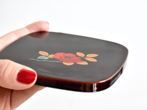 Japanese Urushi Lacquer Coaster Tsubaki Camellia serving tray shown held next to a hand to display its size