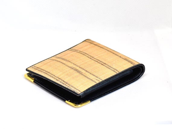 Bashofu banana fiber purse angled view highlighting the gold-toned corners